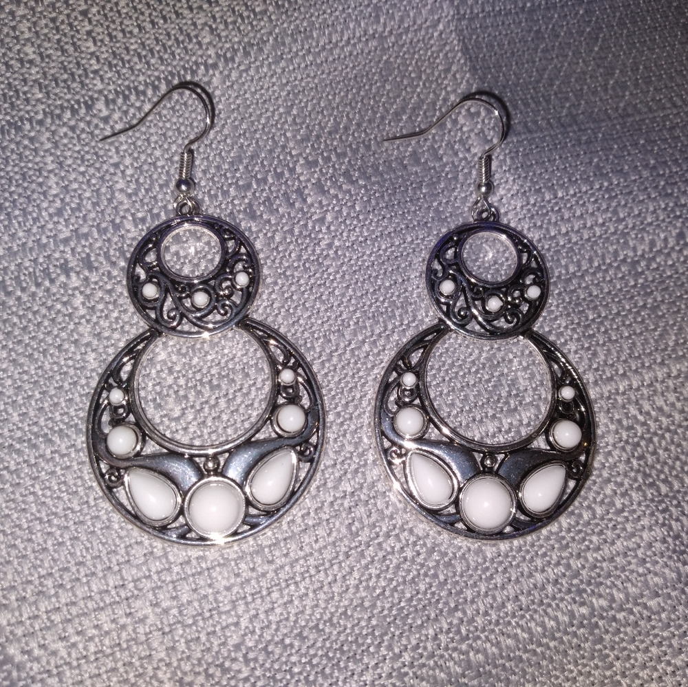 Black and white dangly earrings